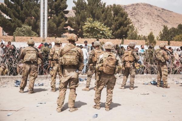  U.S. Soldiers and Marines assist with security at an Evacuation Control Checkpoint during an evacuation at Hamid Karzai International Airport in Kabul, Afghanistan, on Aug. 19, 2021. (Staff Sgt. Victor Mancilla/U.S. Marine Corps via Getty Images)