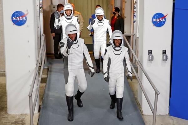 Danish astronaut Andreas Mogensen, (front L), NASA astronaut Jasmin Moghbeli, (front R), Russian cosmonaut Konstantin Borisov, (back L), and Japanese astronaut Satoshi Furukawa leave the Operations and Checkout Building before heading to the launch pad to board the SpaceX Falcon 9 rocket on a mission to the International Space Station, at Kennedy Space Center in Cape Canaveral, Fla., on Aug. 26, 2023. (Terry Renna/AP)
