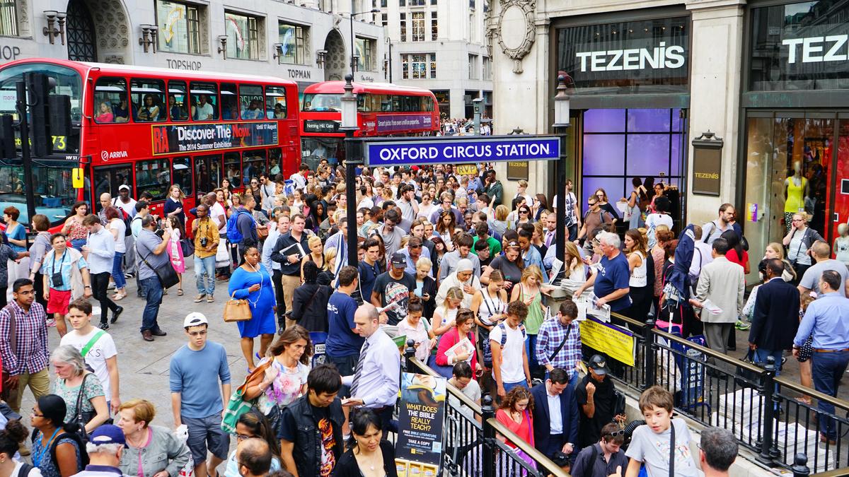 On crowded London streets, people who bump into one another both apologize. (Threerivers11/Dreamstime.com.)