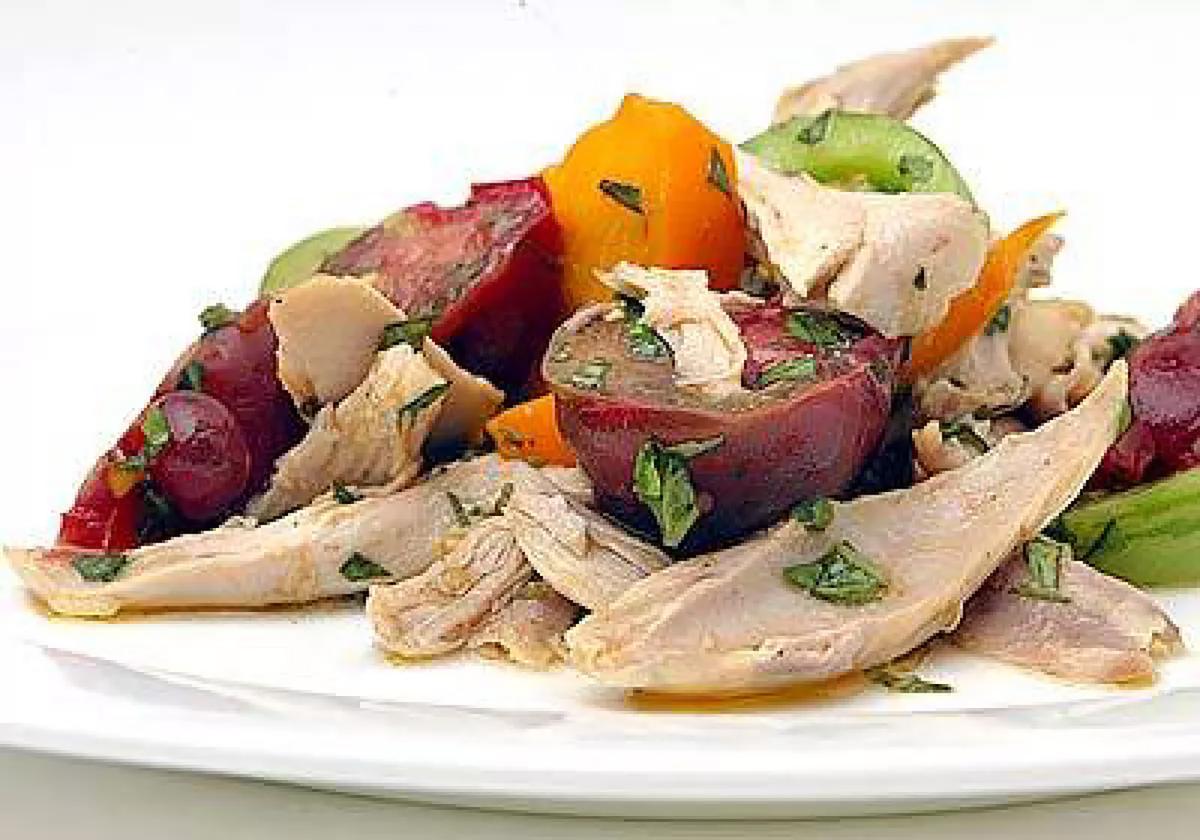 Use rotisserie chicken for an heirloom tomato salad with Banyuls vinaigrette. (Carlos Chavez/Los Angeles Times/TNS)