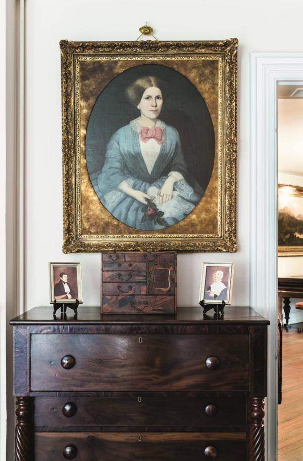 A portrait in a lavish, gilded frame of the mansion’s original matron, Julia Nutt, is the focal point of Longwood’s master bedroom. Atop the mahogany veneered Empire-style dresser owned by the Nutt family, is an intricately inlaid Japanese curio box. Small photographs are of Longwood’s original owner, Haller Nutt, who died in 1864, before the Civil War ended, and of Julia Nutt in her mourning attire. (Courtesy of Pilgrimage Garden Club)