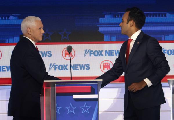Republican presidential candidate former U.S. Vice President Mike Pence (L.) shakes hands with Vivek Ramaswamy (R.) during the first debate of the GOP primary season hosted by FOX News at the Fiserv Forum in Milwaukee, Wisc., on Aug. 23, 2023. (Win McNamee/Getty Images)
