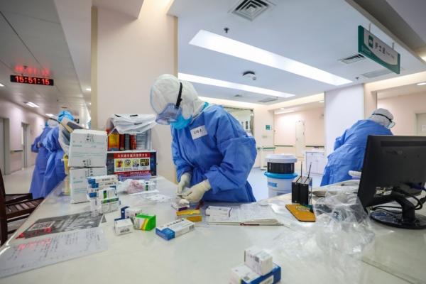 Medical staff prepare medicine for pregnant women, infected by the COVID-19 coronavirus, at a gynecology and obstetrics isolation ward in Wuhan Union Hospital in Wuhan in China's central Hubei Province, on March 7, 2020. (STR/AFP via Getty Images)