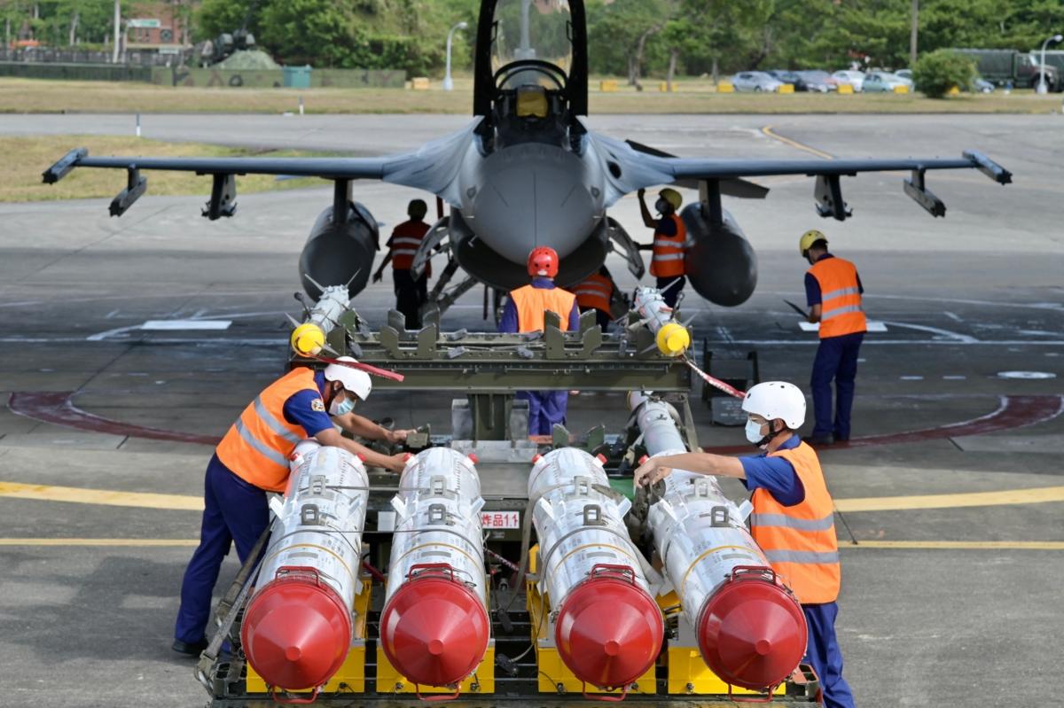 Air Force soldiers prepare to load US-made Harpoon AGM-84 anti-ship missiles in front of an F-16V fighter jet during a drill at Hualien Air Force base, Taiwan, on Aug. 17, 2022. (Sam Yeh/AFP via Getty Images)