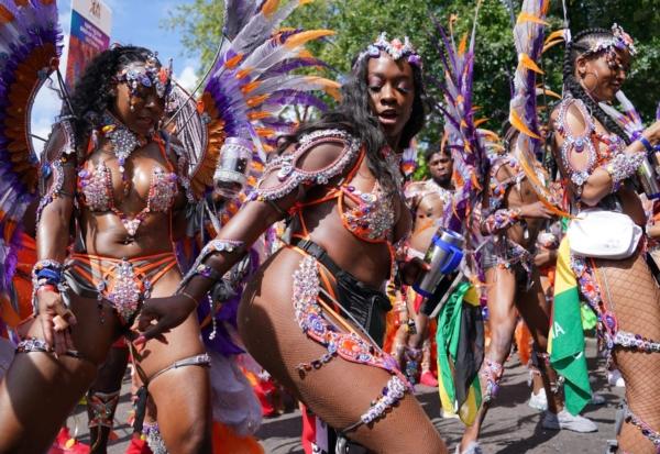 Women dancing at Notting Hill Carnival in Notting Hill, west London, on Aug. 28, 2023. (PA)