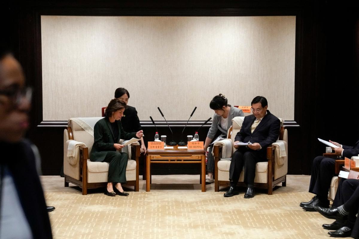 U.S. Commerce Secretary Gina Raimondo and Chinese Minister of Culture and Tourism Hu Heping meet at the Ministry of Culture and Tourism in Beijing on Aug. 29, 2023. (Andy Wong/Pool/AFP via Getty Images)