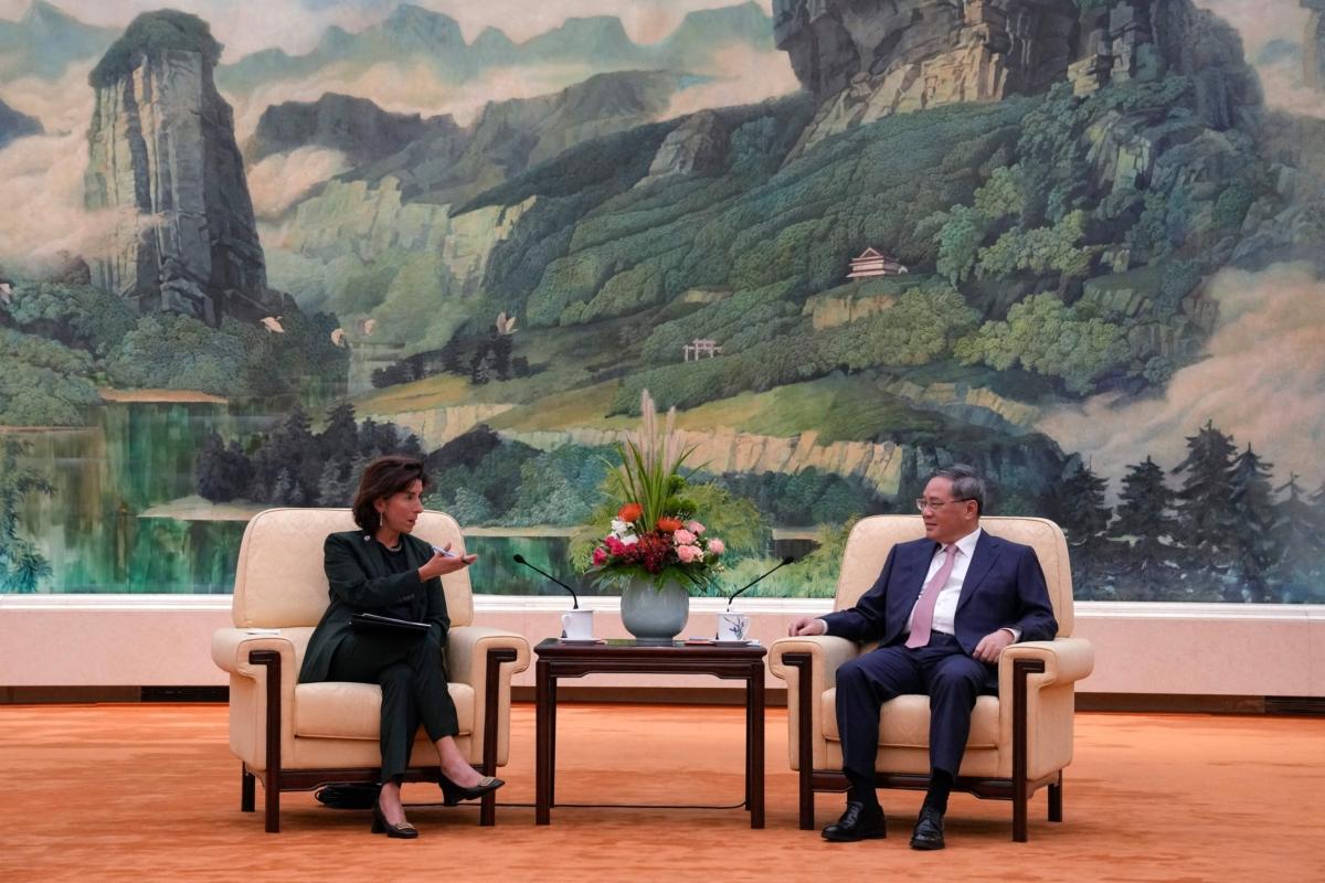 Chinese Premier Li Qiang (R) speaks with U.S. Commerce Secretary Gina Raimondo during their meeting at the Great Hall of the People in Beijing on Aug. 29, 2023. (Andy Wong / AFP via Getty Images)