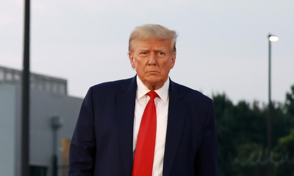 Former President Donald Trump arrives to depart at Atlanta Hartsfield-Jackson International Airport after being booked at the Fulton County jail in Atlanta on Aug. 24, 2023. (Joe Raedle/Getty Images)
