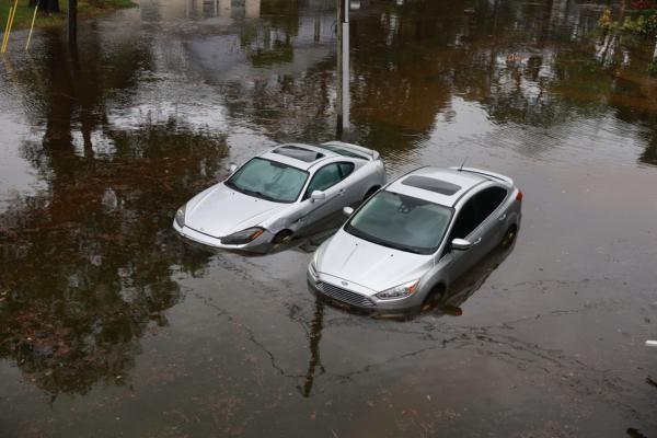Cars sit in flood waters from Hurricane Idalia after it passed offshore in Tarpon Springs, Fla., on Aug. 30, 2023. (Joe Raedle/Getty Images)