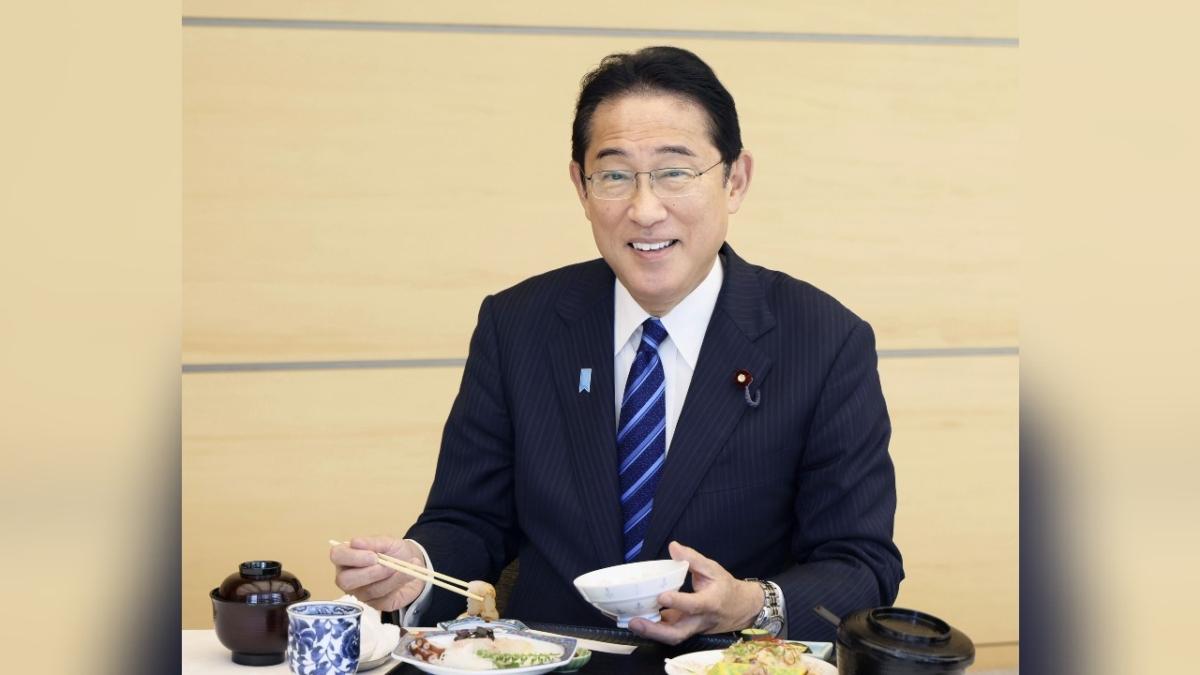 Japanese Prime Minister Fumio Kishida eats seafood from Fukushima Prefecture at lunch at the prime minister's office in Tokyo on Aug. 30, 2023. (Cabinet Public Affairs Office via AP)