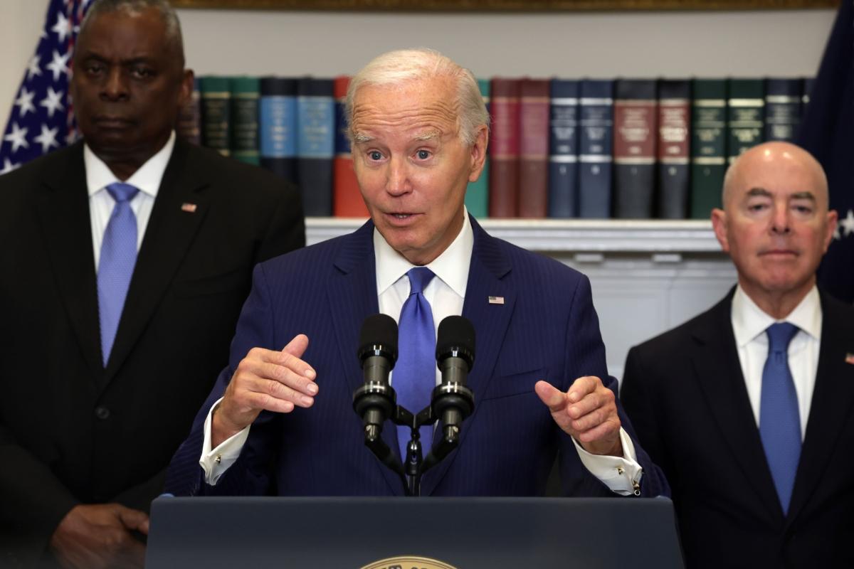 President Joe Biden speaks on the government response and recovery efforts to the wildfires in Maui, Hawaii, and the federal government response to Hurricane Idalia, as Secretary of Defense Lloyd Austin (L) and Secretary of Homeland Security Alejandro Mayorkas (R) listen at the White House on Aug. 30, 2023. (Alex Wong/Getty Images)