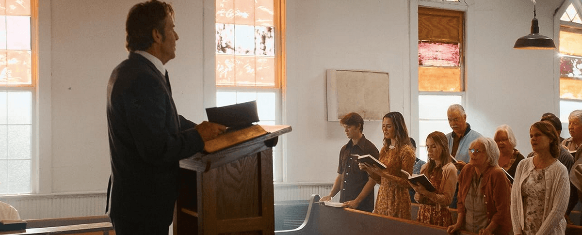 Pastor James Hill (Dennis Quaid) preaches to his flock, in “The Hill.” (Briarcliff Entertainment)