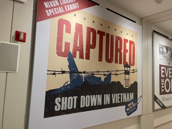 A poster of the ‘Captured: Shot Down In Vietnam’ exhibit is displayed at Nixon Library in Yorba Linda, Calif., on Aug. 29, 2023. (Carol Cassis/The Epoch Times)