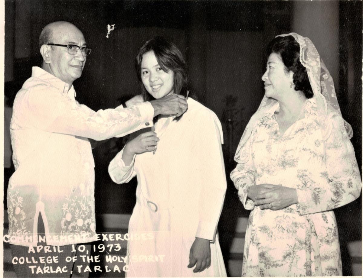 Elizabeth Ann at her high school graduation with parents Gualberto and Lulu Reyes Besa. (Courtesy of Elizabeth Ann Besa-Quirino)