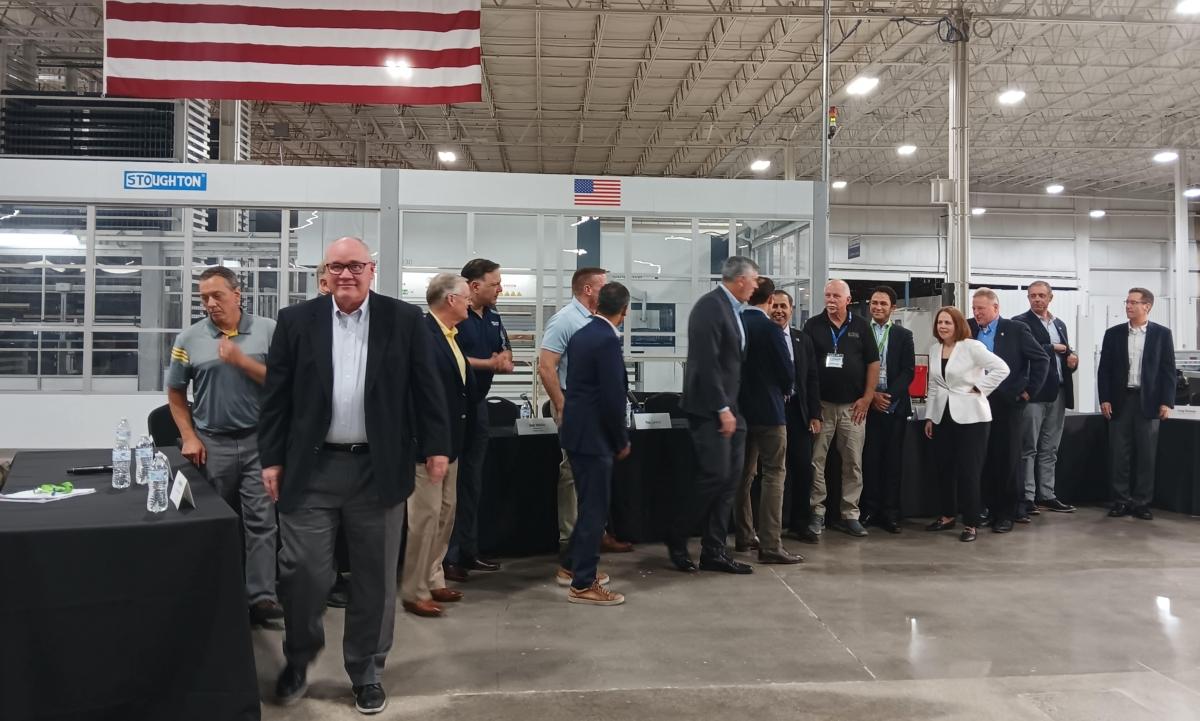 Reps. Darin LaHood (R-Ill.), Mike Gallagher (R-Wis.), and Raja Krishnamoorthi (D-Ill.) of the House Select Committee on the CCP visit the facility to discuss China's threat to U.S. manufacturing at an event at Stoughton Trailers in Stoughton, Wis., on Aug. 30, 2023. (Nathan Worcester/The Epoch Times)