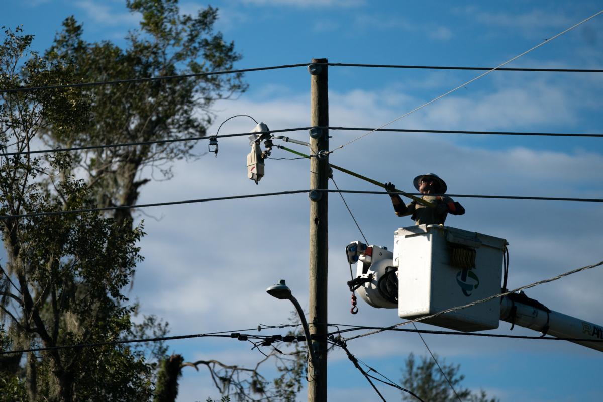 A lineman works to restore service in the aftermath of Hurricane Idalia in Perry, Fla., on Aug. 31, 2023. (Sean Rayford/Getty Images)
