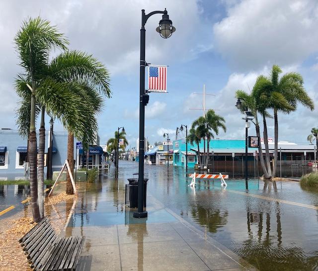 Storm surge flooding from Hurricane Idalia stubbornly swills on Dodecanese Boulevard in Tarpon Springs, Fla., on Aug. 29, 2023, more than 12 hours after Hurricane Idalia passed. (John Haughey/The Epoch Times)