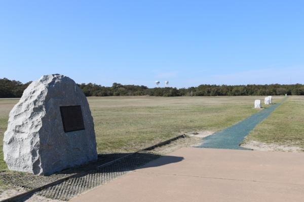 The First Flight Boulder and the Flight Line mark the location where the first flights took off and landed on Dec. 17, 1903. (National Park Service)