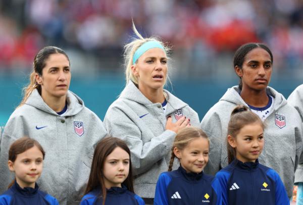 (L-R) Savannah Demelo, Julie Ertz and Naomi Girma of USA line up for the national anthem prior to the FIFA Women's World Cup Australia & New Zealand 2023 Group E match between USA and Vietnam at Eden Park in Auckland, New Zealand, on July 22, 2023. (Phil Walter/Getty Images)