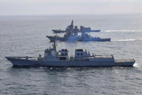 In this handout image released by the South Korean Defense Ministry, South Korean Navy's destroyer Yulgok Yi I (front), U.S. Navy's USS Benfold (middle), and Japan Maritime Self-Defense Force's JS Atago (top) sail in formation during a joint naval exercise in international waters on April 17, 2023, at an undisclosed location. (South Korean Defense Ministry via Getty Images)
