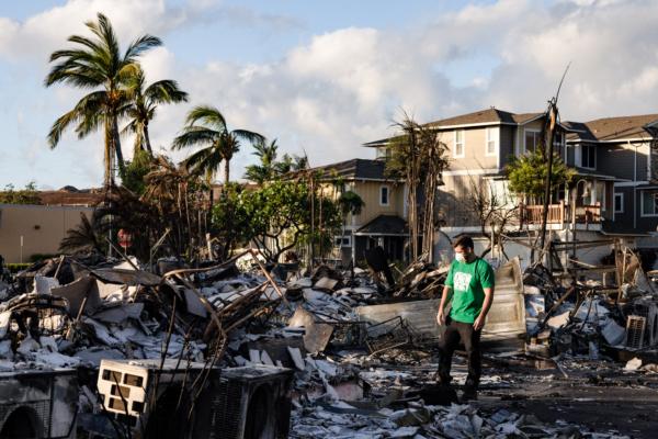 A Mercy Worldwide volunteer makes damage assessment of a charred apartment complex in the aftermath of a wildfire in Lahaina, western Maui, Hawaii, on Aug. 12, 2023. (Yuki Iwamura/AFP via Getty Images)