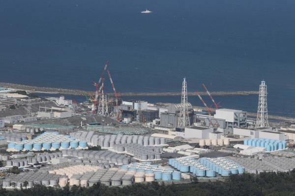 This aerial picture shows storage tanks used for storing treated water at TEPCO's crippled Fukushima Daiichi Nuclear Power Plant in Okuma, Fukushima prefecture, Japan, on Aug. 24, 2023.  (STR/JIJI Press/AFP via Getty Images)