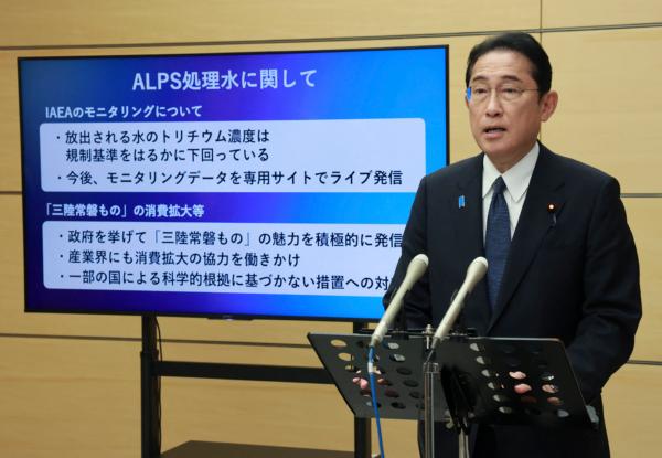 Japan's Prime Minister Fumio Kishida speaks to reporters about water from the Fukushima nuclear power plant that has been treated with the Advanced Liquid Processing System (ALPS), at the prime minister's office in Tokyo on Aug. 24, 2023. (STR/JIJI Press/AFP via Getty Images)