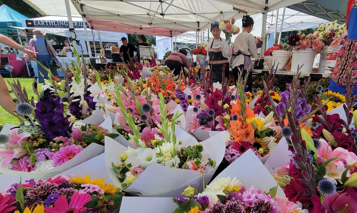 Flowers are among the many possible purchases at the farmers market in Gig Harbor, Washington. (Photo courtesy of Jim Farber)
