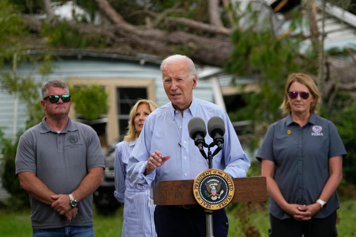 President Joe Biden speaks in front of a home damaged by fallen trees and debris following a survey of damage caused by Hurricane Idalia, in Live Oak, Fla., on Sept. 2, 2023. (Julio Cortez/AP Photo)