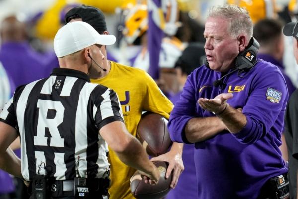 LSU head coach Brian Kelly (R), has a discussion with referee Derek Anderson during the first half of an NCAA college football game against Florida State in Orlando, Fla., on Sept. 3, 2023. (John Raoux/AP Photo)