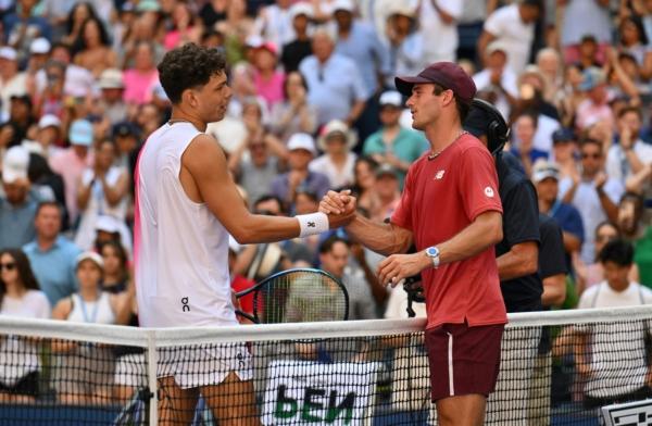 USA's Ben Shelton (L) and USA's Tommy Paul shake hands following the US Open tennis tournament men's singles round of 16 match at the USTA National Tennis Center in New York City, on Sept. 3, 2023. (Angela Weiss/AFP via Getty Images)