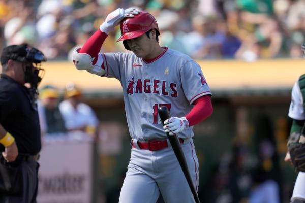 Los Angeles Angels' Shohei Ohtani walks to the dugout after striking out against the Oakland Athletics during the seventh inning of a baseball game in Oakland, Calif., on Sept. 3, 2023. (Jeff Chiu/AP Photo)