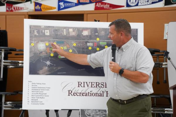 Port Jervis Mayor Kelly Decker presents the Riverside Park improvement project at the Downtown Revitalization Initiative local planning committee meeting at Port Jervis High School in Port Jervis, N.Y., on Aug. 31, 2023. (Cara Ding/The Epoch Times)