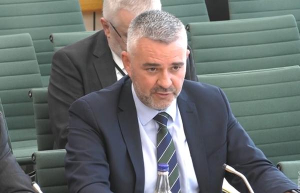 Liam Kelly, chairman of the Police Federation of Northern Ireland (PFNI), answering questions in front of the Northern Ireland Affairs Select Committee, in the House of Commons, London, on Sep. 5, 2023. (PA Media)