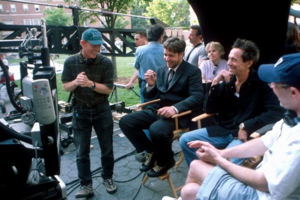 On the set of “A Beautiful Mind” (L–R): Director Ron Howard, actor Russell Crowe, and producer Brian Grazer.  (MovieStillsDB)