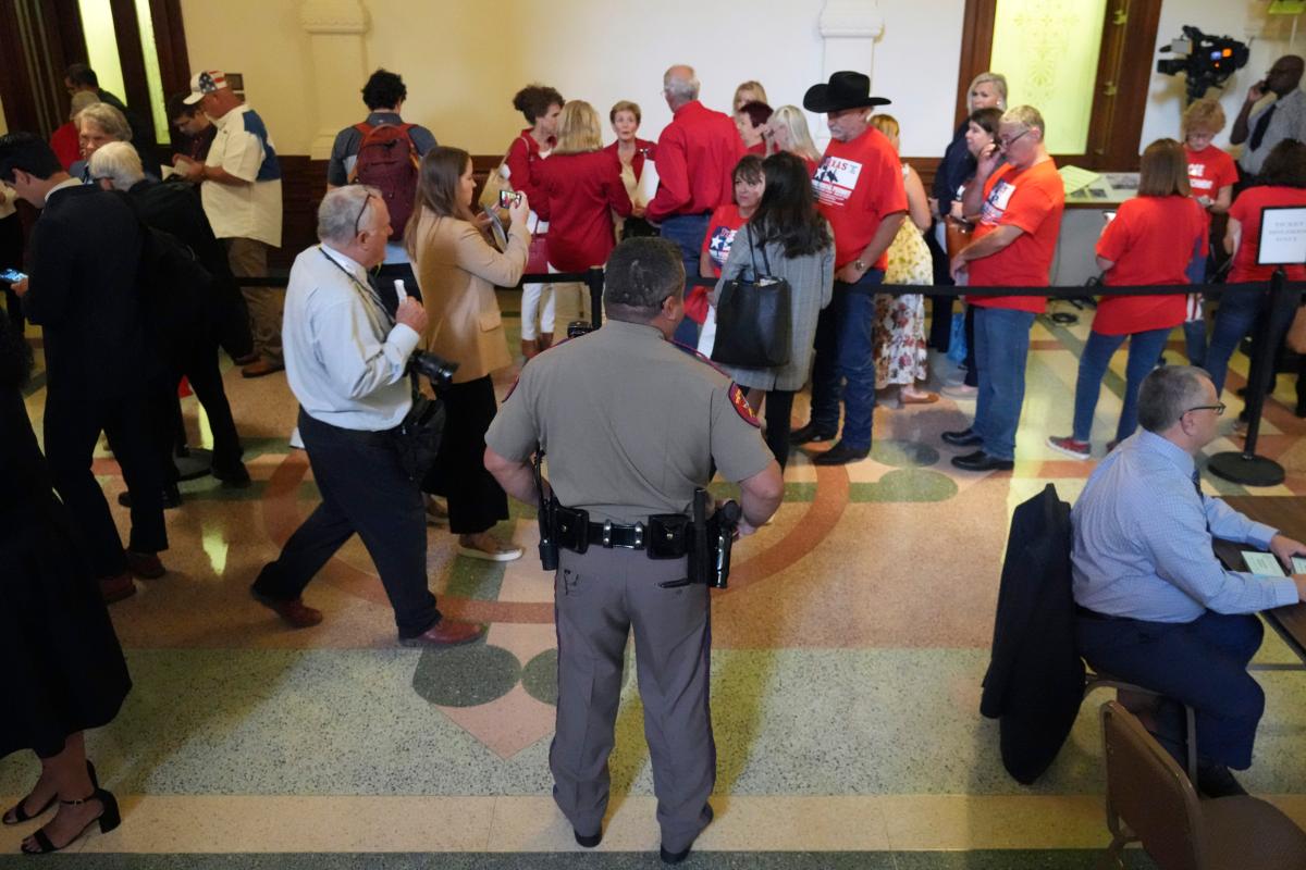Members of the public line up outside the Texas State Senate Gallery, waiting to enter for the start of the impeachment trial of Texas Attorney General Ken Paxton in Austin, Texas, on Sept. 5, 2023. (LM Otero/AP Photo)