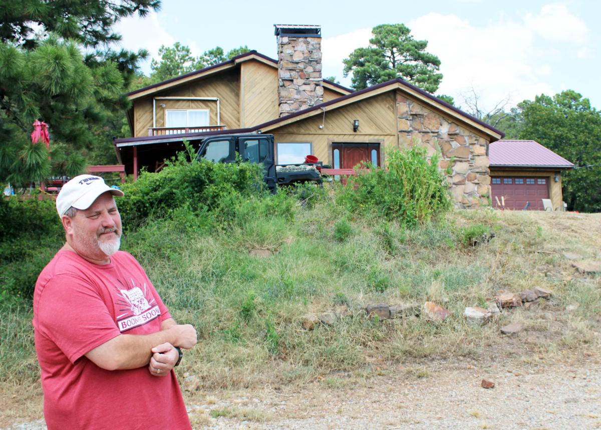 Russell Fincher stands in front of his house in Tuskahoma, Okla., on Sept. 1, 2023. (Michael Clements/The Epoch Times)