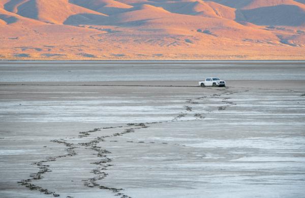 Footprints lead away from a truck stuck in the mud outside of the Burning Man festival in Black Rock, Nev., on Sep. 4, 2023. (John Fredricks/The Epoch Times)