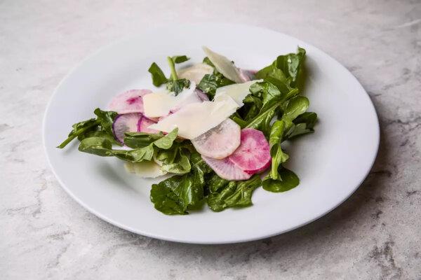 Big bowls of salad, teeming with vegetables and fruits and cheese, are ideal for easy end-of-summer cooking, like this Radish Salad With Lime and Parmesan. (Myung J. Chun/Los Angeles Times/TNS)
