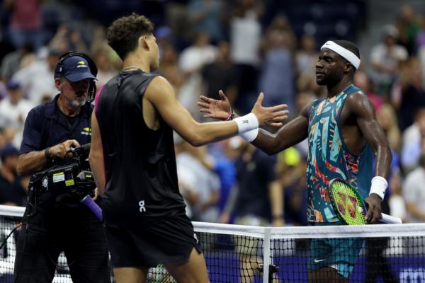 Ben Shelton of the United States shakes hands with Frances Tiafoe of the United States after their Men's Singles Quarterfinal match on Day Nine of the 2023 US Open at the USTA National Tennis Center in the Flushing neighborhood of the Queens borough of New York City on Sept. 5, 2023. (Elsa/Getty Images)