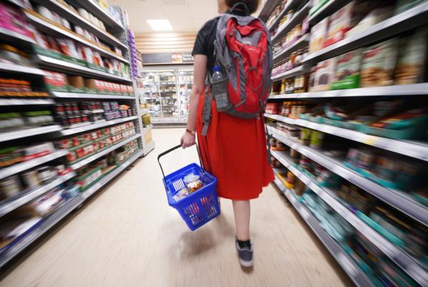 A shopper walking through the aisle of an unidentified Tesco supermarket in England on Sep. 3, 2022. (PA)