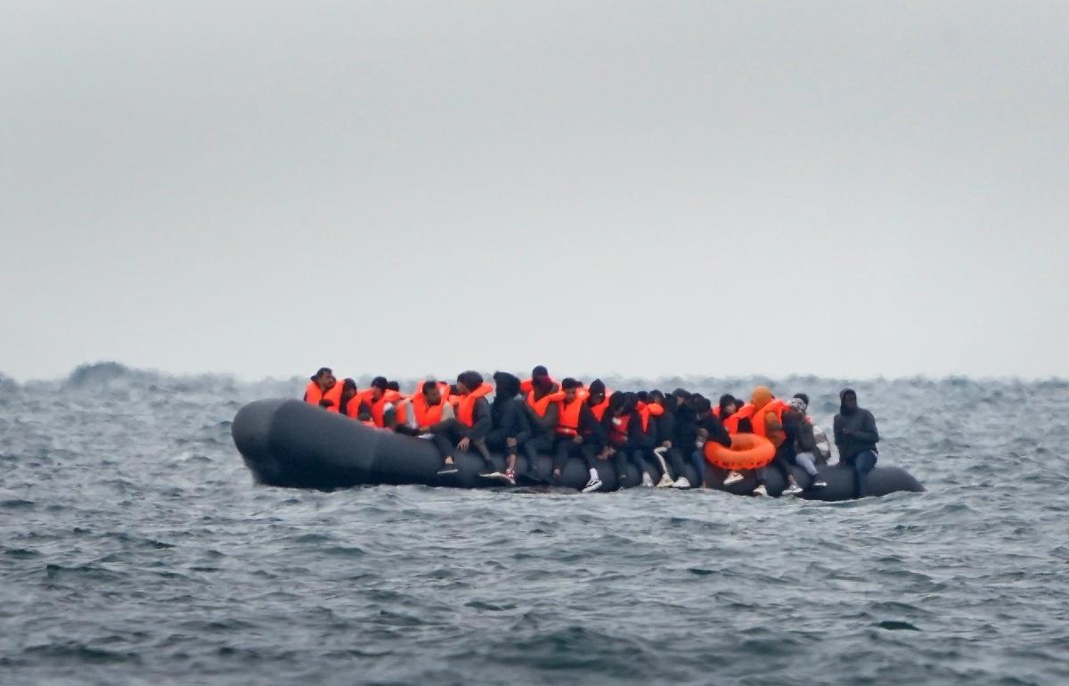 A group of people thought to be migrants crossing the Channel in a small boat travelling from the coast of France and heading in the direction of Dover, Kent on Aug. 29, 2023. (PA Media)