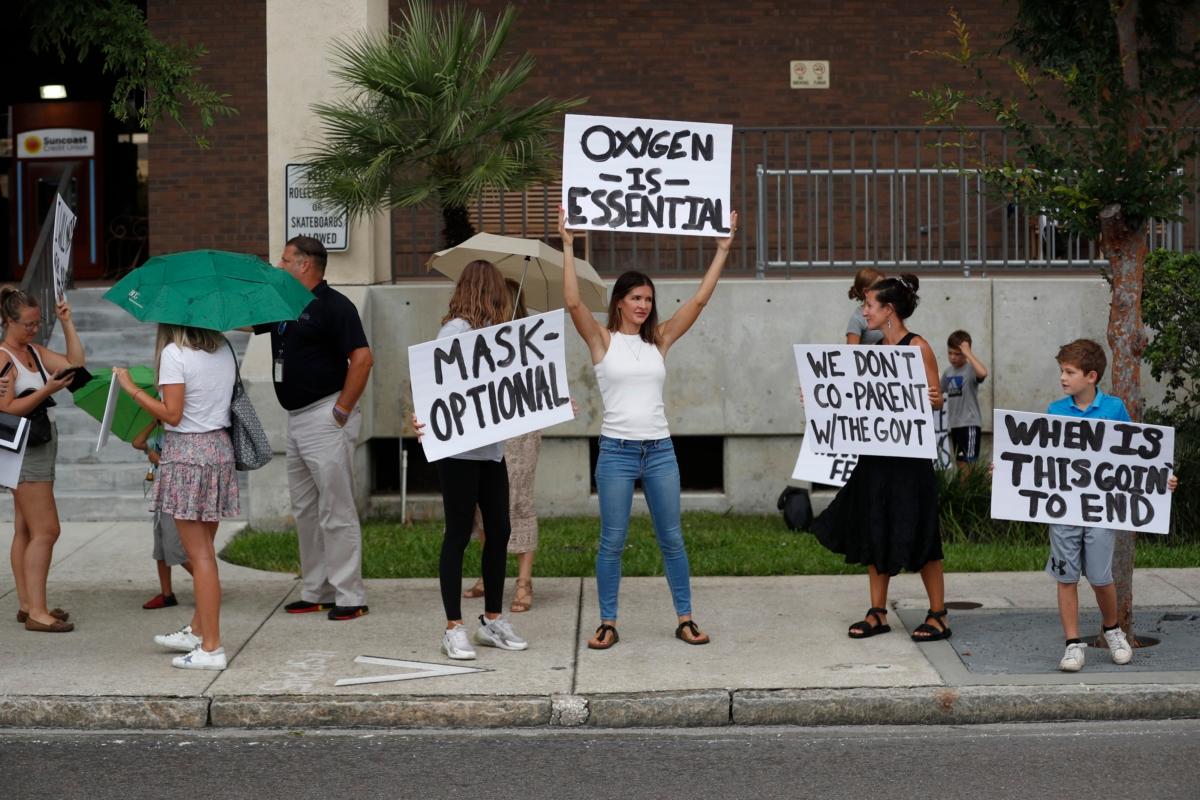 Families protest potential mask mandates before the Hillsborough County Schools Board meeting held at the district office in Tampa, Florida, on July 27, 2021. (Octavio Jones/Getty Images)