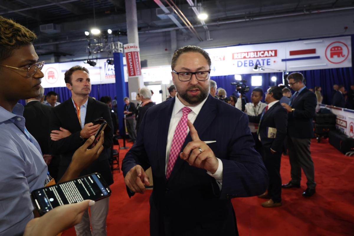 Jason Miller, a strategic adviser for Republican presidential candidate, former U.S. President Donald Trump, talks to members of the media in the spin room following the first debate of the GOP primary season hosted by FOX News at the Fiserv Forum in Milwaukee, Wis., on Aug. 23, 2023. (Scott Olson/Getty Images)