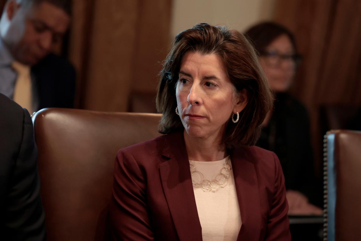 Commerce Secretary Gina Raimondo listens as President Joe Biden speaks to reporters before the start of a cabinet meeting at the White House on March 3, 2022. (Anna Moneymaker/Getty Images)