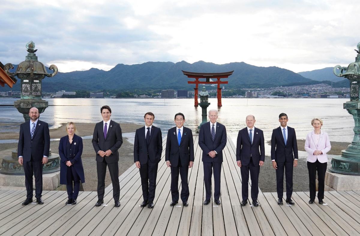G7 leaders (L to R) European Council President Charles Michel, Italian Premier Giorgia Meloni, Canadian Prime Minister Justin Trudeau, French President Emmanuel Macron, Japanese Prime Minister Fumio Kishida, U.S. President Joe Biden, German Chancellor Olaf Scholz, UK Prime Minister Rishi Sunak, and European Commission President Ursula von der Leyen pose for a group photo at the Itsukushima Shrine during the G7 Summit in Hiroshima, Japan, on May 19, 2023. (Stefan Rousseau/Pool/Getty Images)