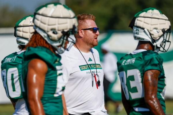 University of South Florida NCAA college football head coach Alex Golesh looks on during the first day of fall practice on a field near the Porter Family Performance Facility on the USF campus in Tampa, Fla., on Aug. 2, 2023. (Ivy Ceballo/Tampa Bay Times via AP)