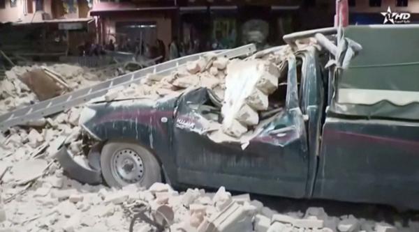 View of a damaged car and debris from the earthquake in Marrakech, Morocco, on Sept. 9, 2023, in this screen grab taken from a video. (Al Oula TV/Handout via Reuters)