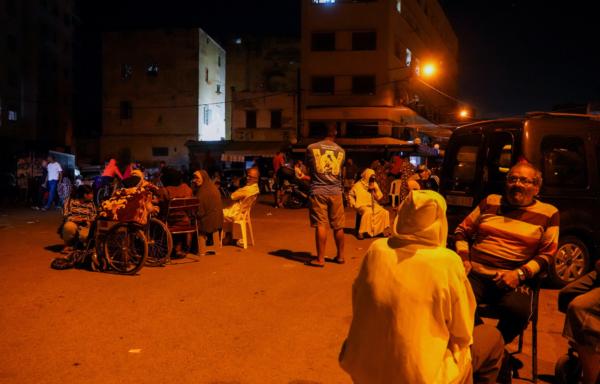 People gather on a street in Casablanca, following a powerful earthquake in Morocco, on Sept. 9, 2023. (Abdelhak Balhaki/Reuters)