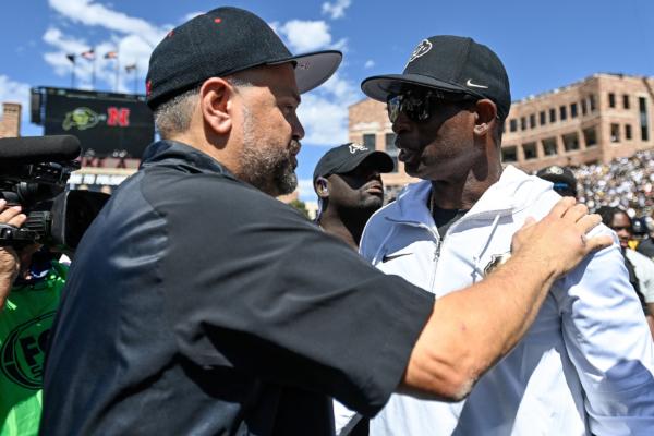 Head coach Matt Rhule of the Nebraska Cornhuskers and head coach Deion Sanders of the Colorado Buffaloes shake hands after a Colorado Buffaloes win at Folsom Field in Boulder, Colo., on September 9, 2023. (Dustin Bradford/Getty Images)